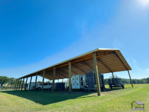 Functional 40x120 pole barn for agricultural equipment storage.